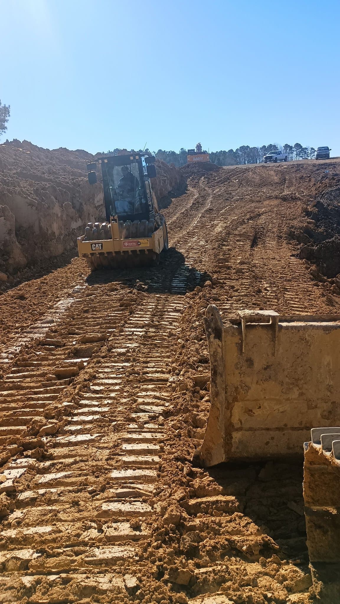 Dozer work on a deep cut slope